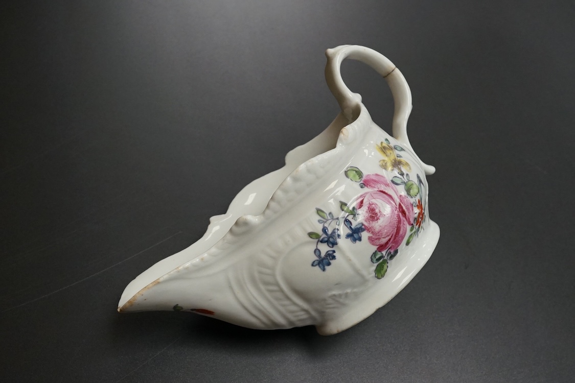 A Liverpool porcelain sauceboat, handpainted with flowers, circa 1760, 14cm wide